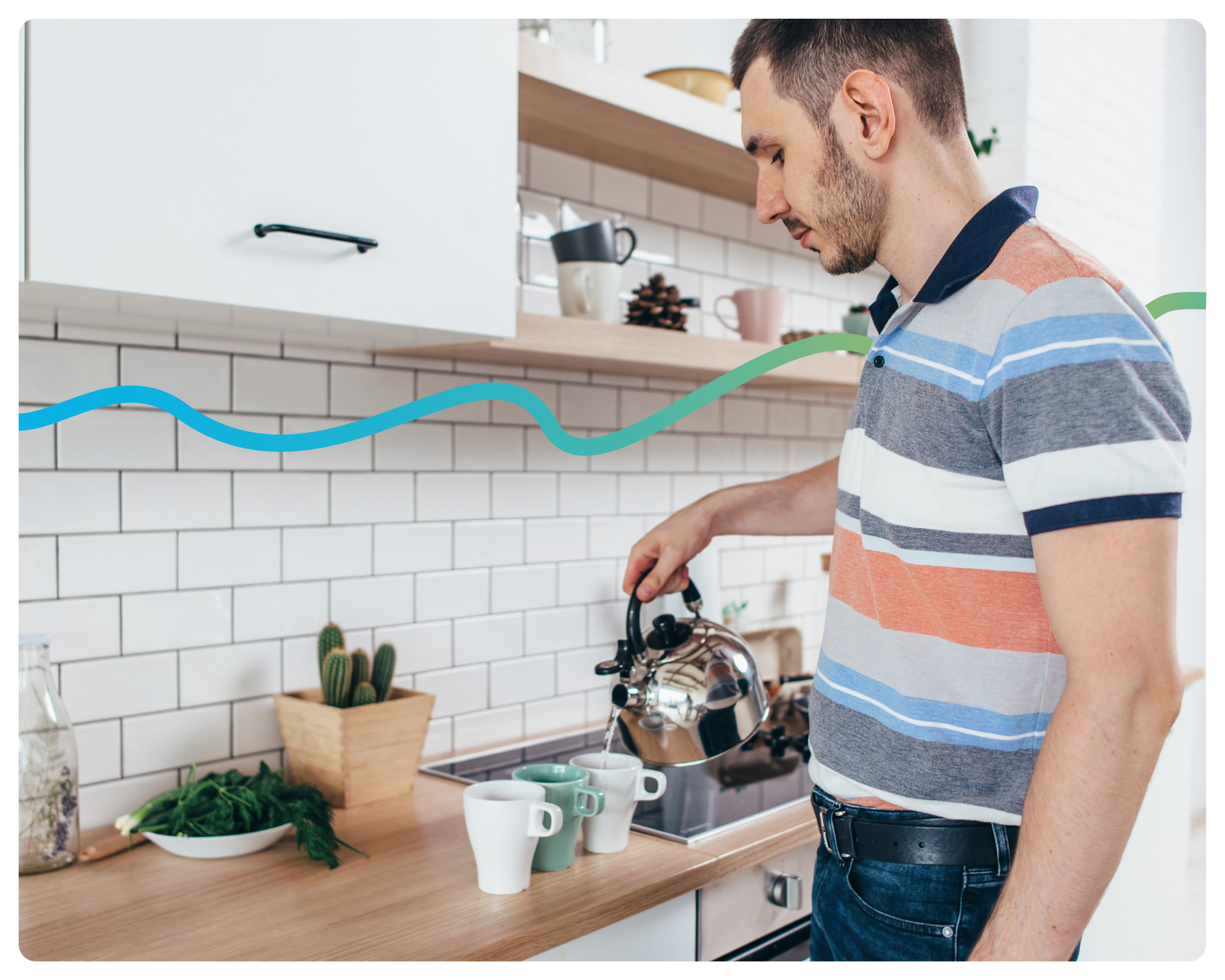 A man in his kitchen using a kettle to pour hot water into cups