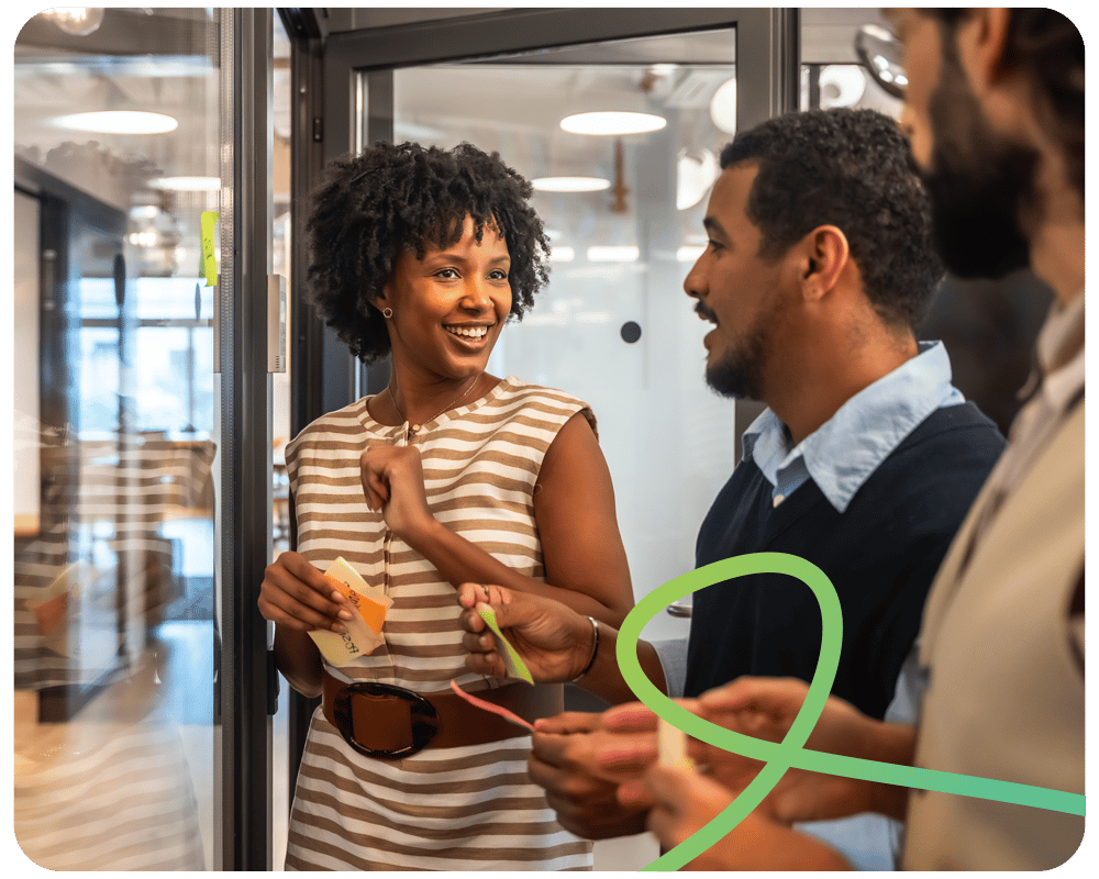 Image of a female staff member speaking to her male colleagues