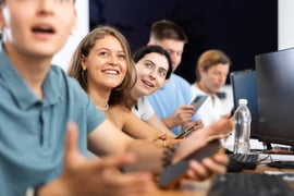 Cheerful young female student studying together