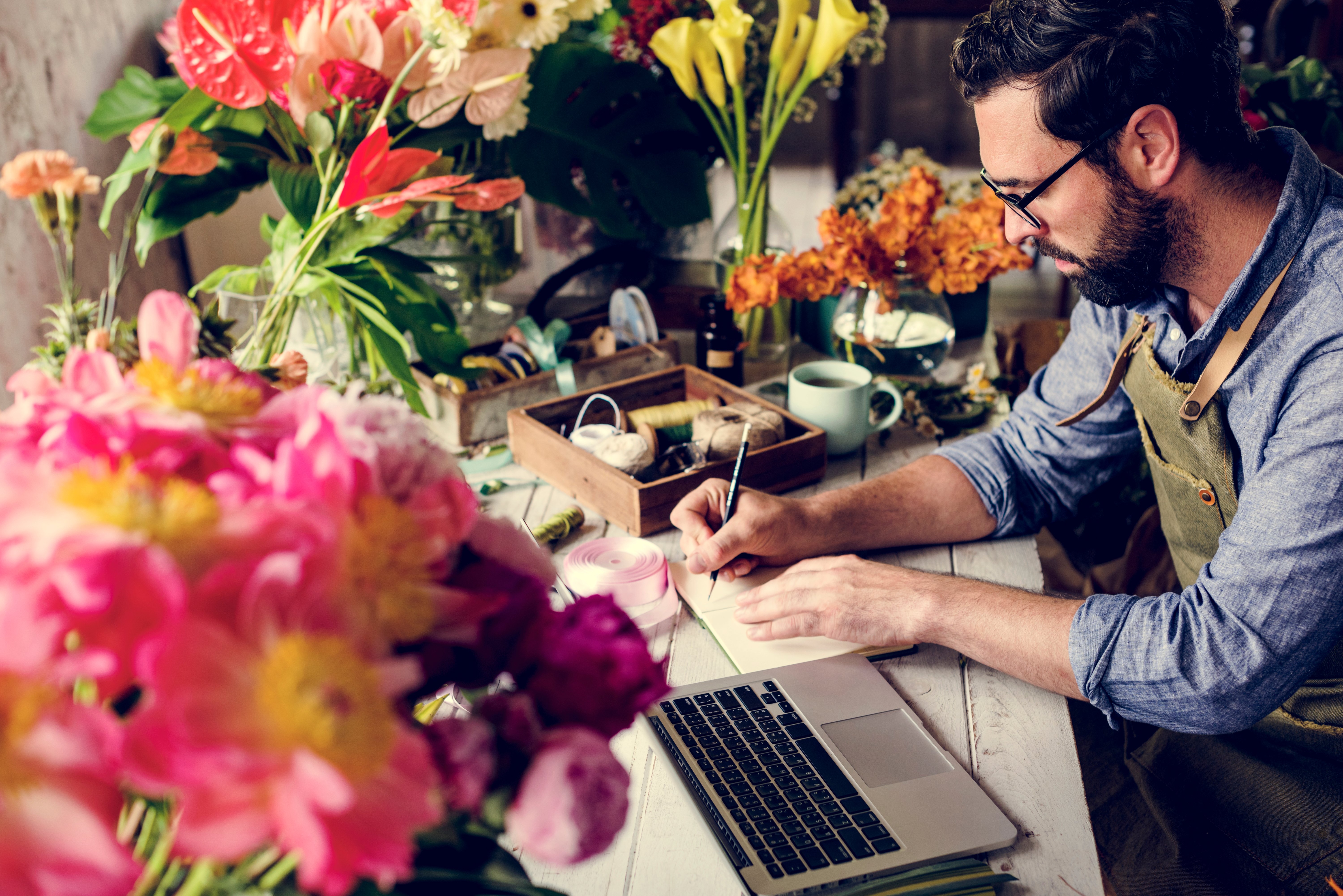 Flower shop business owner working service