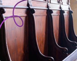 Image of a row of benches in a court room