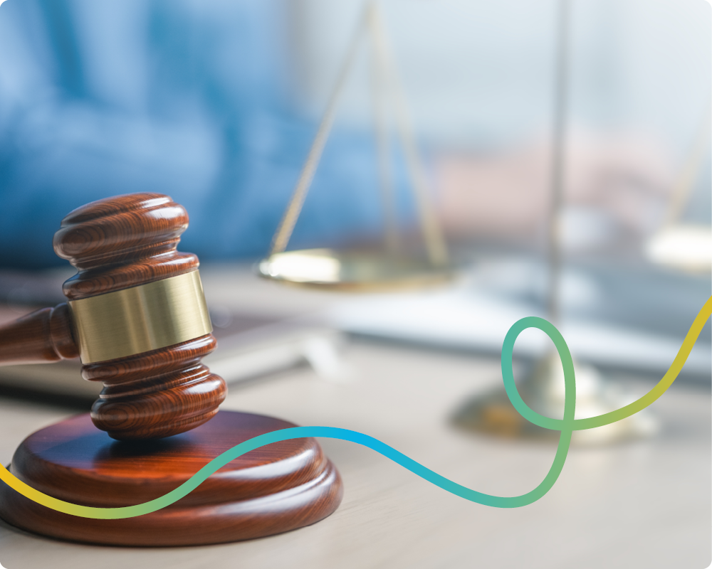 Image of a gavel and a scale of justice with a connecting line running through the image
