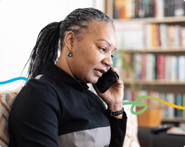 A side profile of a woman talking on the phone.