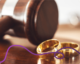 Image of two wedding rings and a gavel in the background with a purple connecting line.