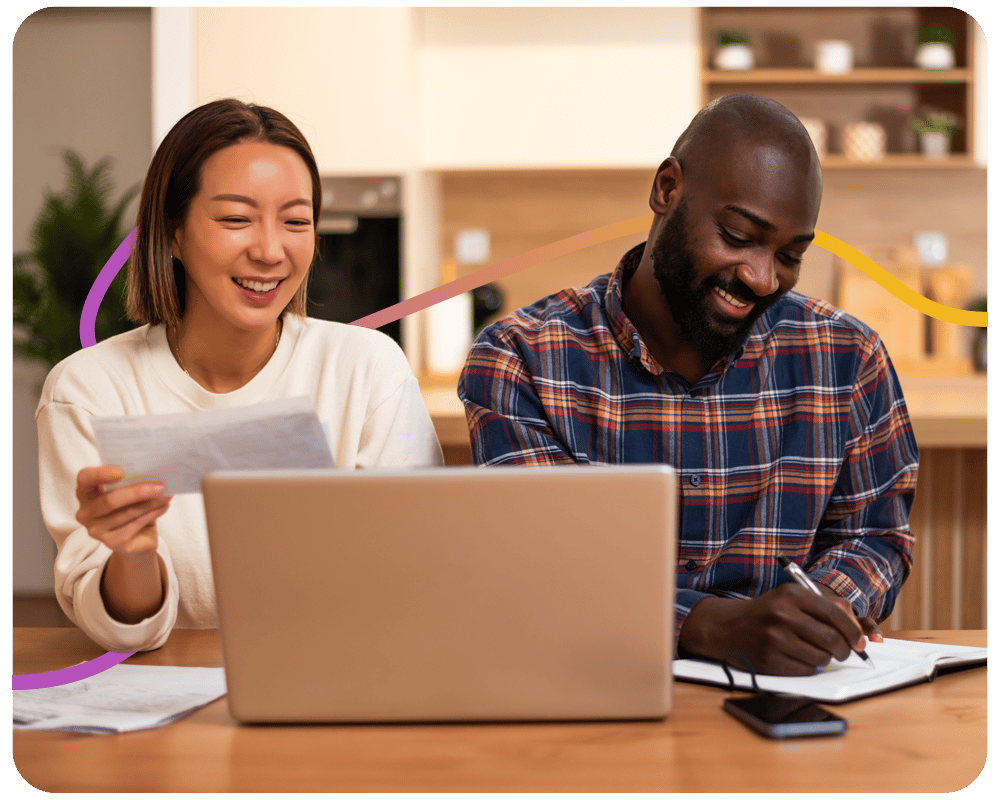 Image of a couple sitting down reviewing their bills