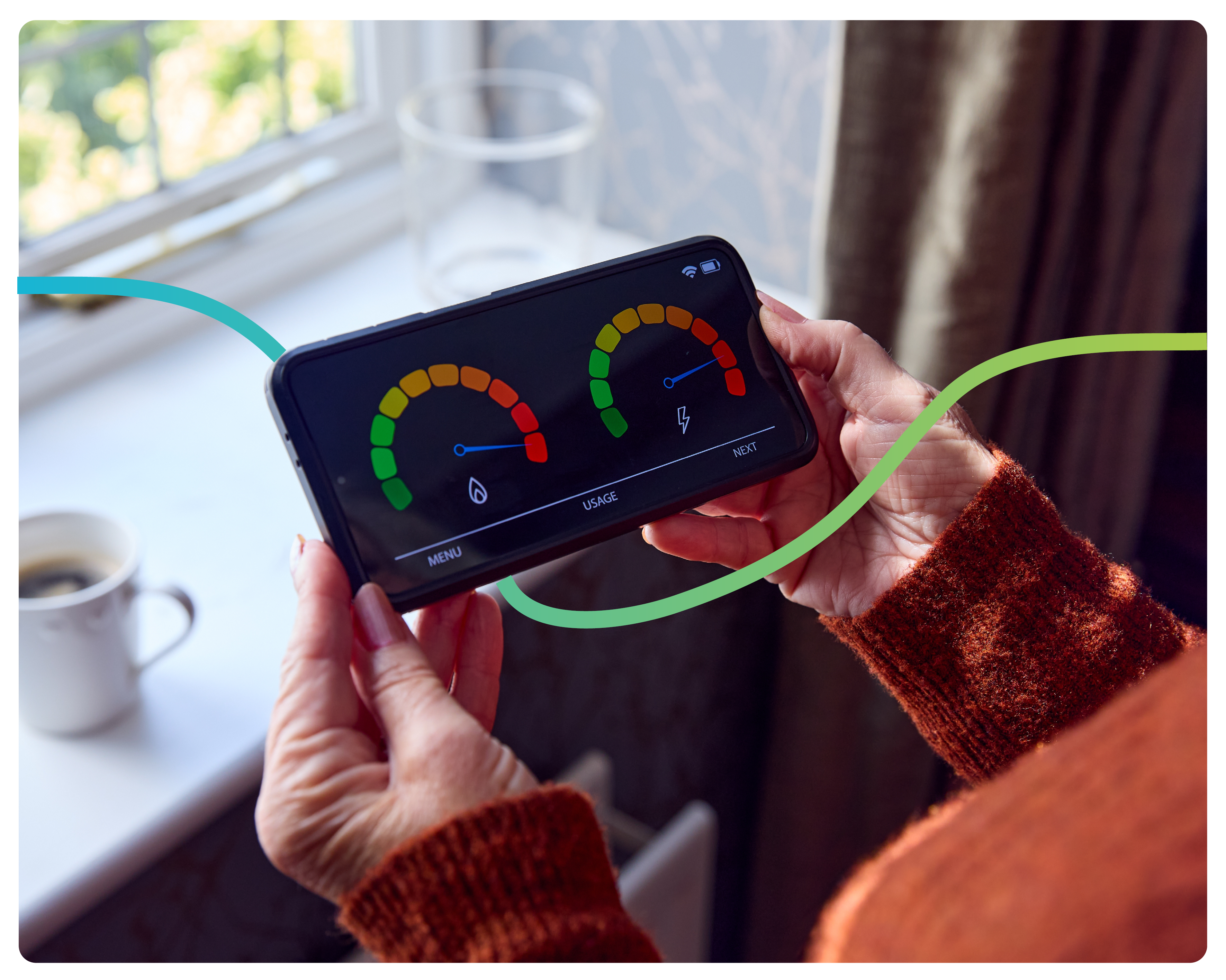 An over the shoulder shot of a woman holding an in-home display screen for her smart meter.