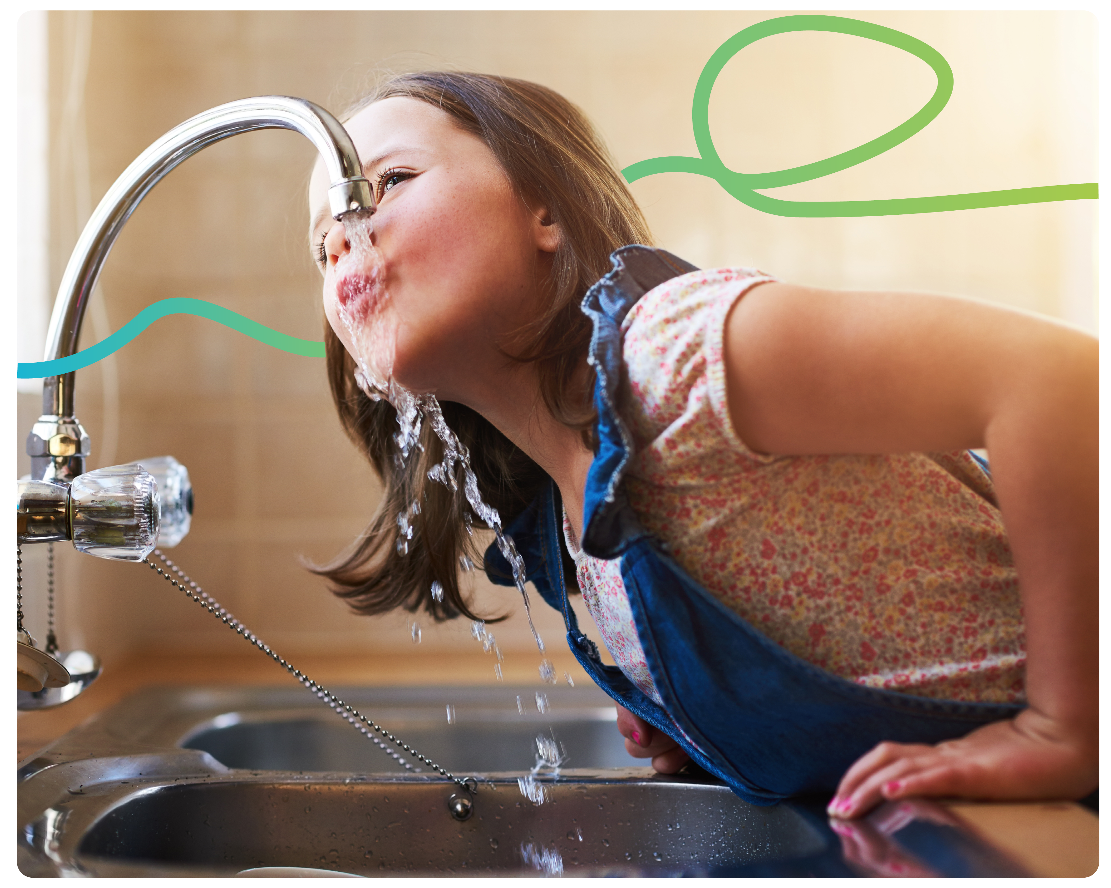 A young girl holding onto the sink, drinking from the tap