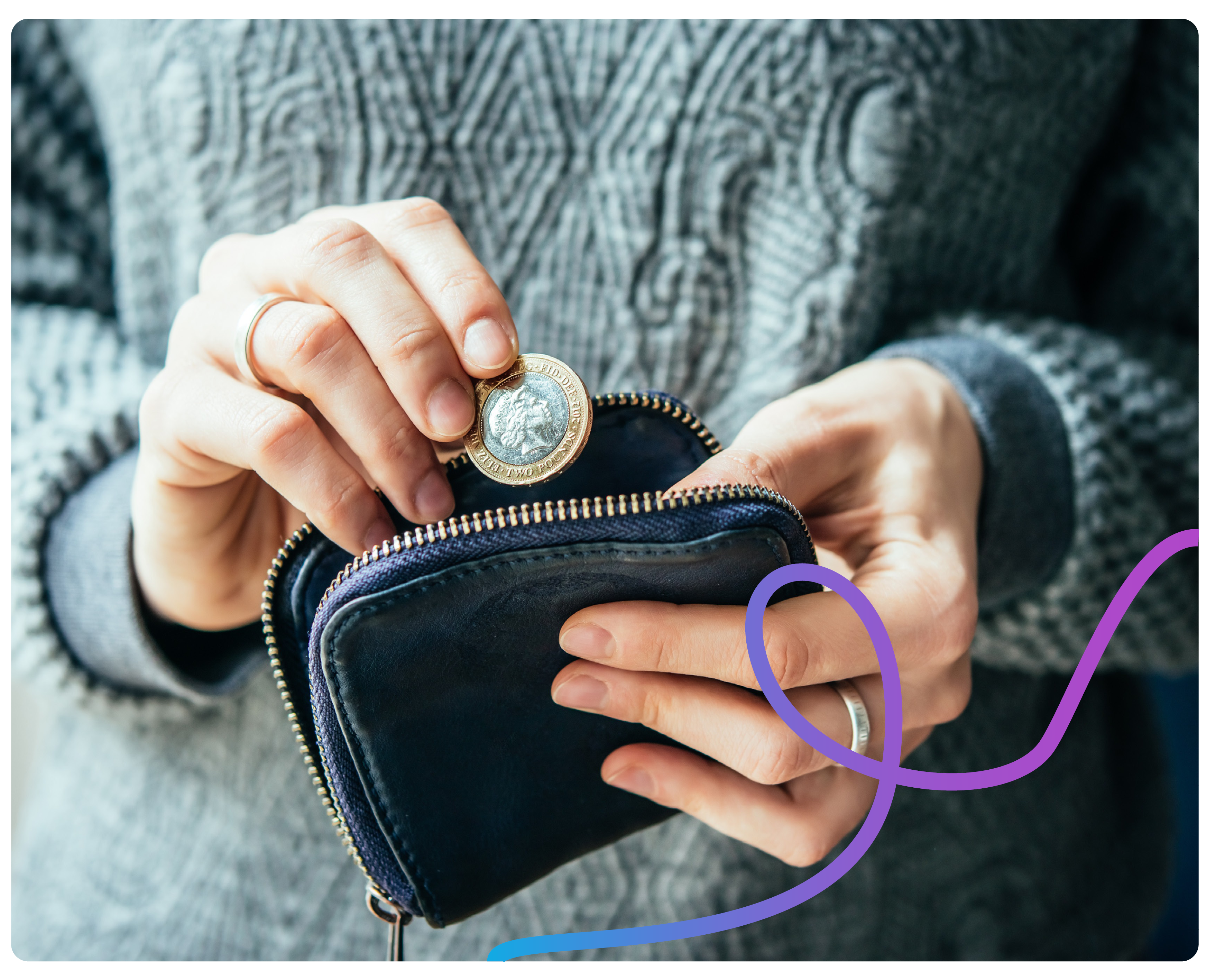 A close up of someone putting money in their purse