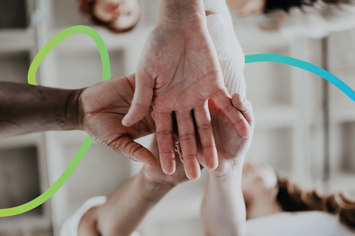 Hands coming together to show connection and collaboration