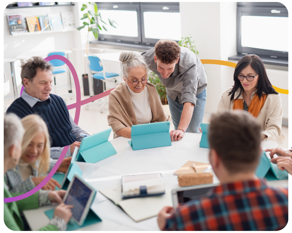 A group of elderly people getting digital skills training
