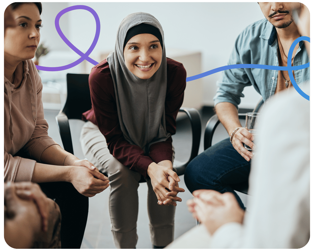 image of a group of people sat in chairs in a circle