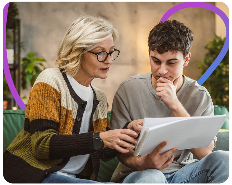 Senior woman explaining paperwork to a younger man